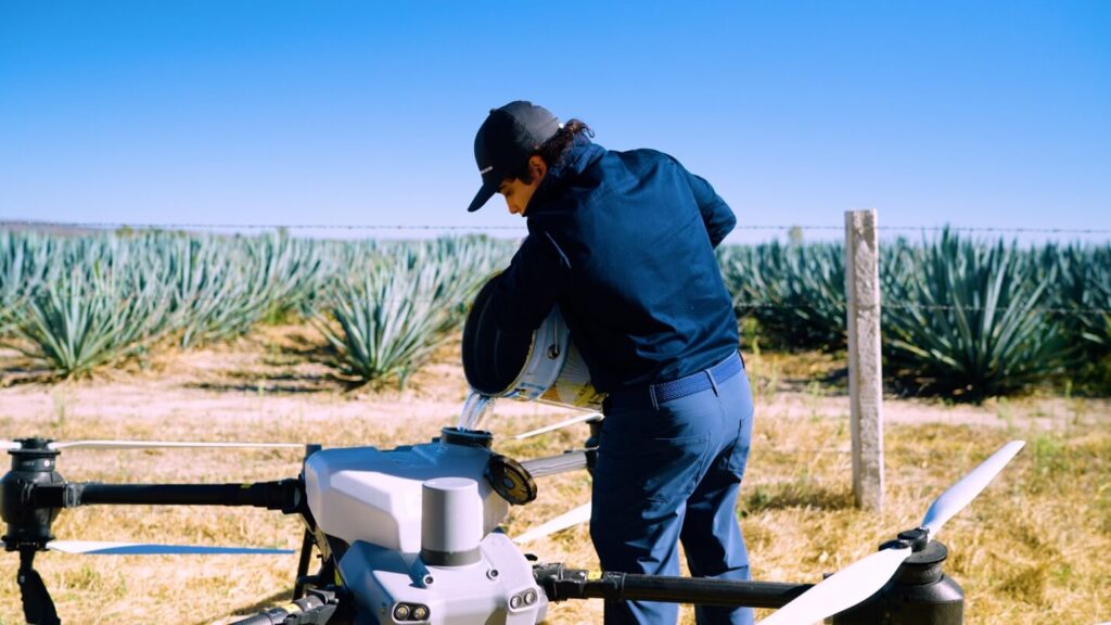 Agricultural drones are not small. Eight rotors are used on the DJI T40 & T50 to provide enough lift to carry the payload.